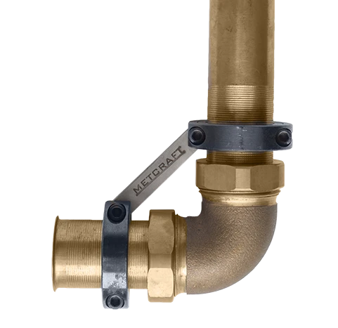 A Metcraft Flush Valve Stabilizer installed on a pipe fitting.